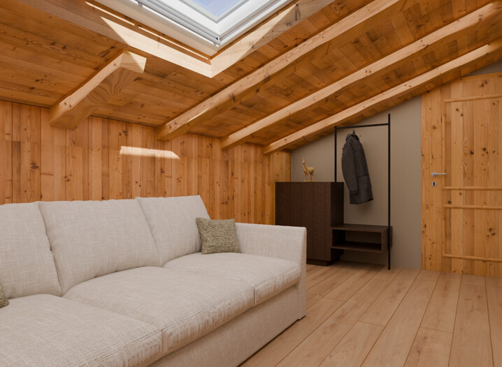 Gemütliches Zimmer mit schräger Holzdecke, Dachfenster, hellgrauem Sofa und Garderobe mit Jacke.