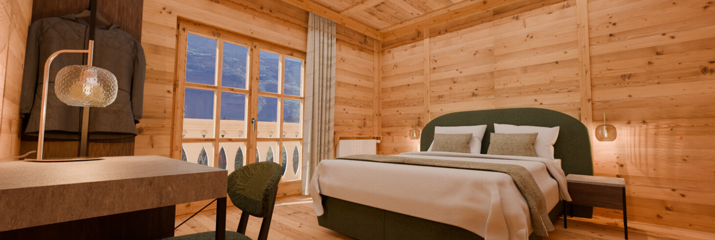 Camera da letto con pareti e pavimento in legno, letto matrimoniale con coperte bianche, comodino con lampada, sedia e tavolo, finestra con vista sulle montagne.