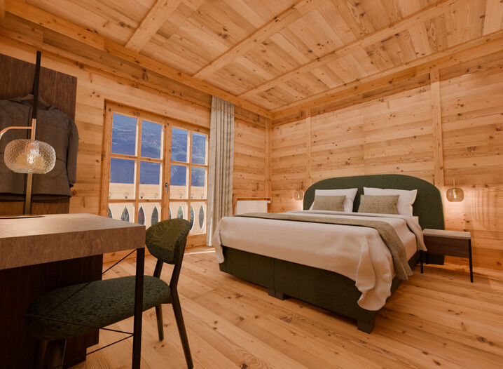 Camera da letto con pareti e pavimento in legno, letto matrimoniale con coperte bianche, comodino con lampada, sedia e tavolo, finestra con vista sulle montagne.